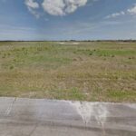 2426 Ottowa Cir, Palm Bay looking toward lot from street